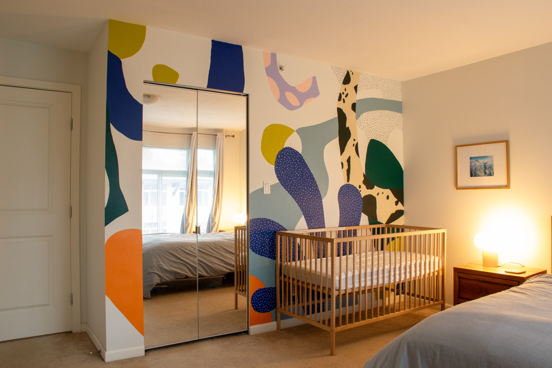 Primary bedroom with mirrored closet doors